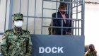 Uganda president signs law bringing back military trials for civilians